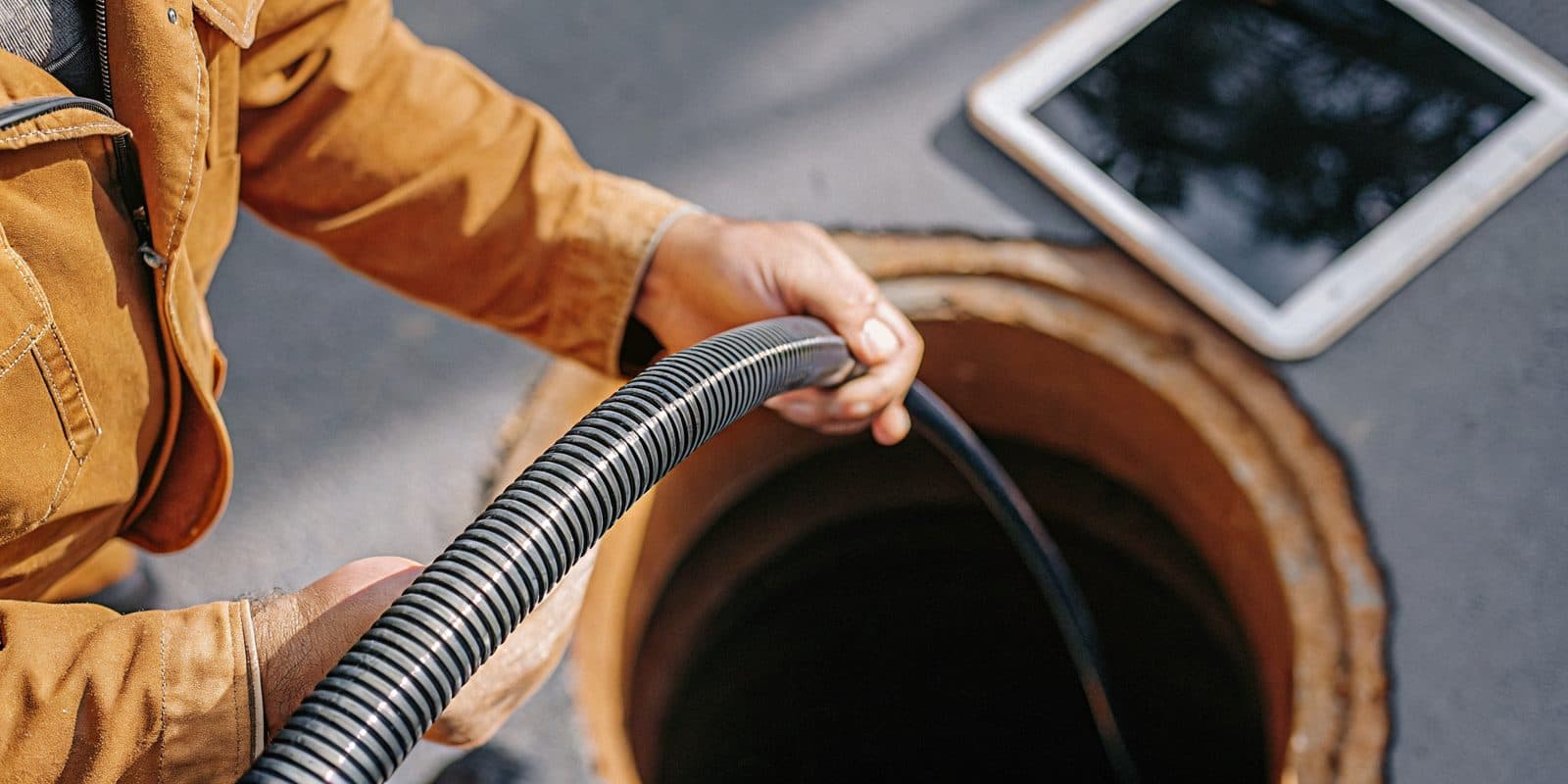 A Wish Granted Plumbing technician running a sewer camera inspection on a main line